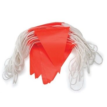 Red flags on a white string stacked in a pile