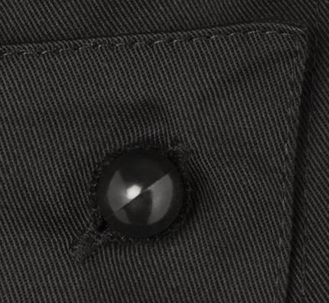 Close up of a black Chef+39s Button in a shirt