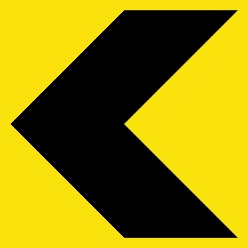 A yellow and black Chevron Sign