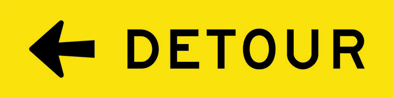 A yellow and black Detour Left Sign