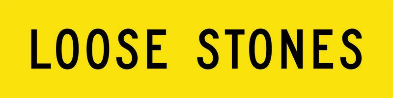 A yellow and black Loose Stones Sign