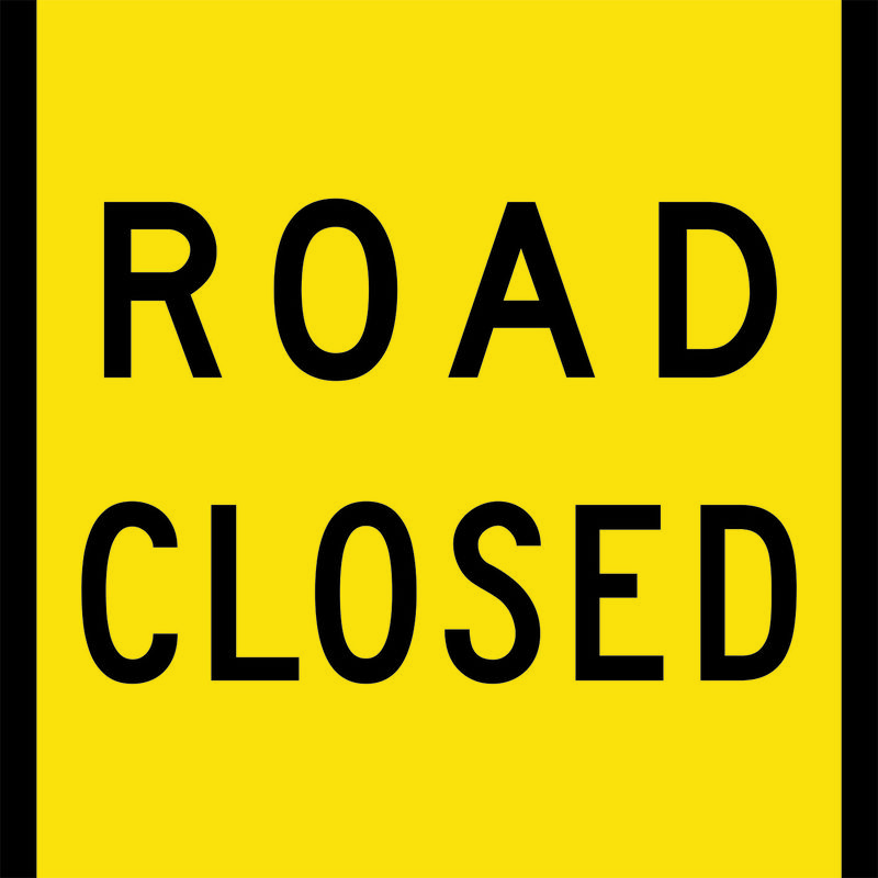 A yellow Road Closed Sign