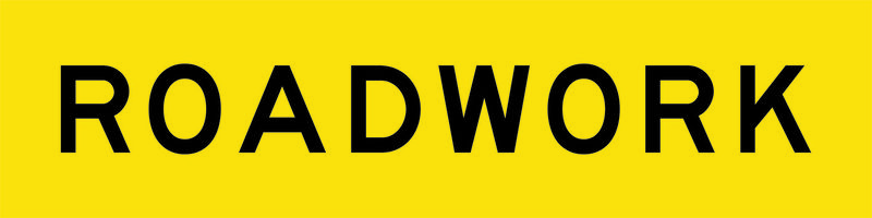 A yellow and black Roadwork Sign