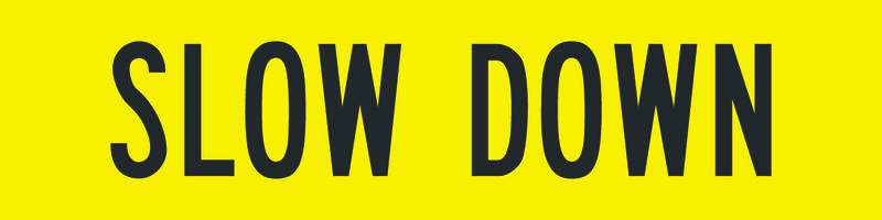 A yellow and black Slow Down Sign