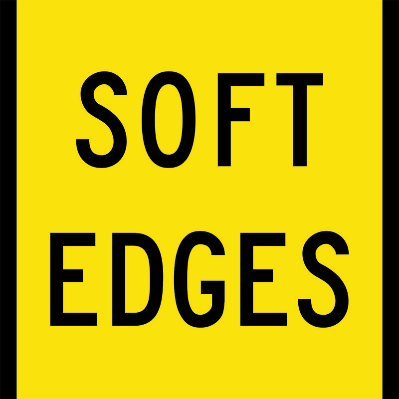 A yellow and black Soft Edges Sign