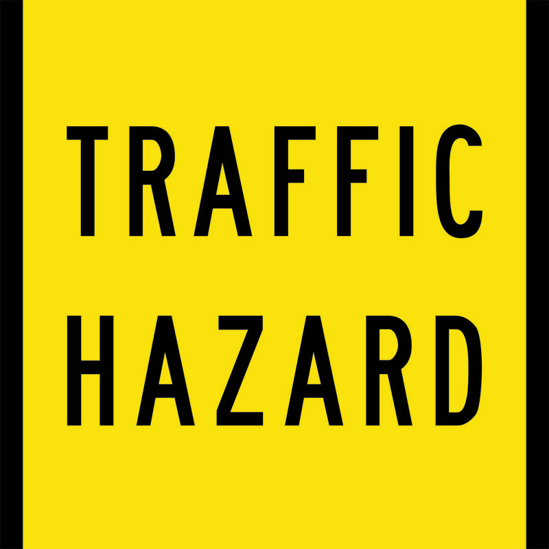 A yellow and black Traffic Hazard Sign