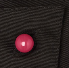 A red Chef+39s Button on black fabric