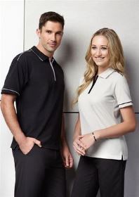 A man and a woman wearing two different coloured Heritage Polo Shirt